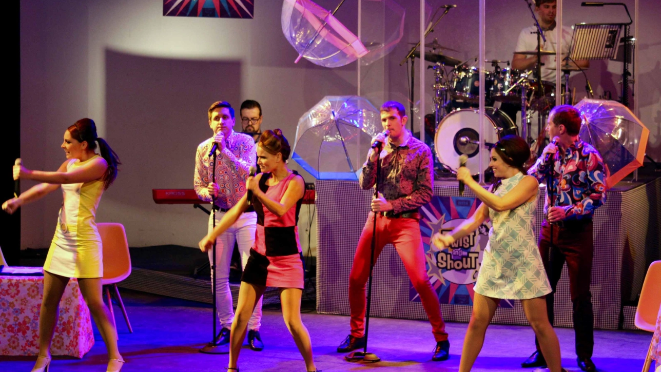 Twist and Shout band performing a song 